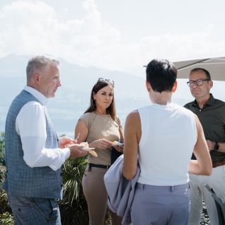 Networking during the seminar break with a view of the lake